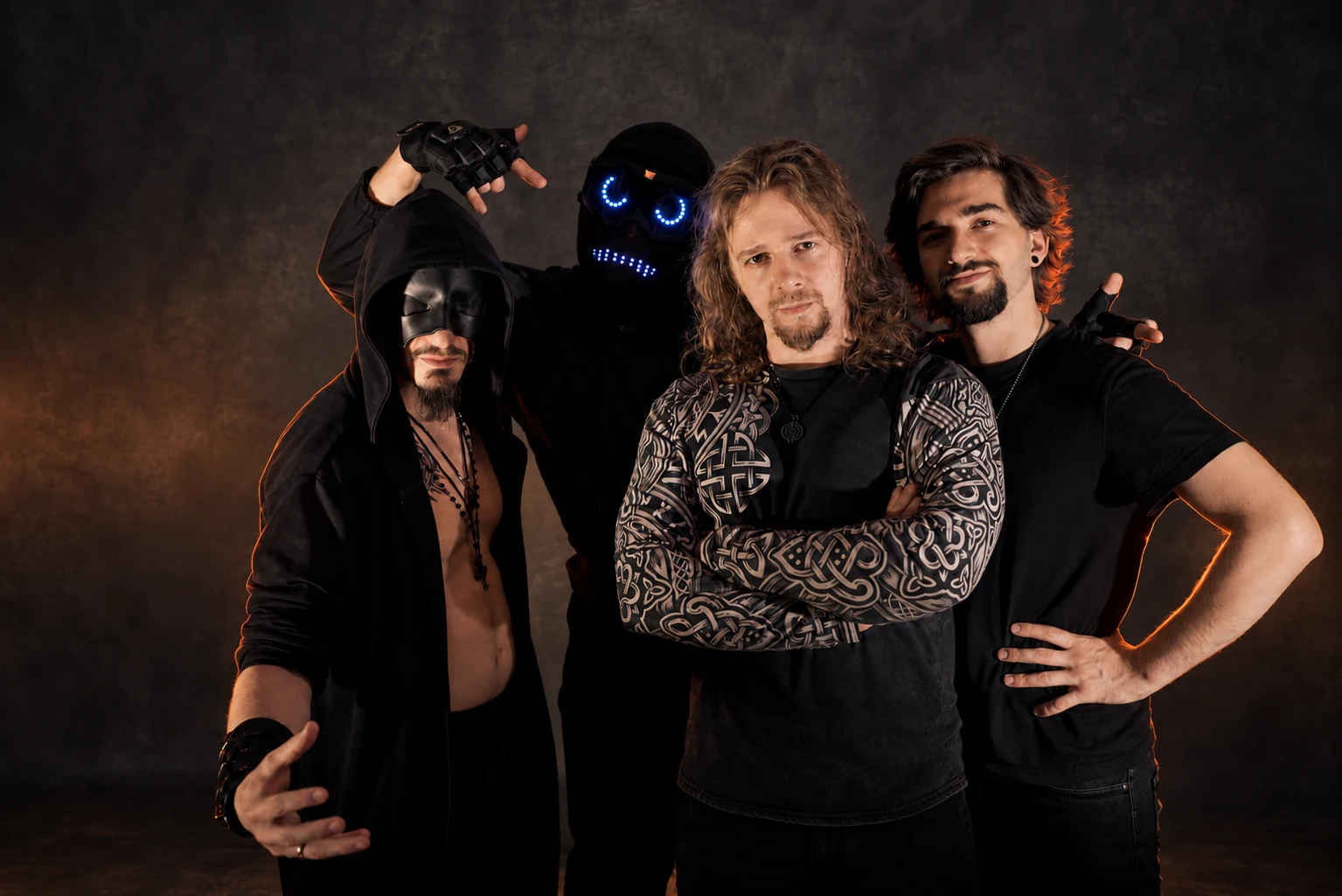 MemoCrasher — four members of the band against a warm, dark backdrop.